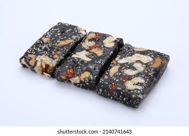 Ejiao Gao Walnut And Sesame Donkey Hide Gelatin Cubes Close-up For Use In Chinese Traditional Medicine