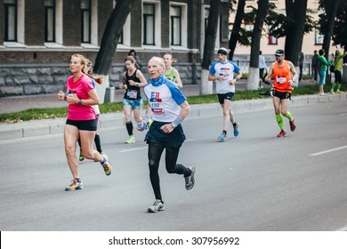 Ekaterinburg, Russia - August 01, 2015:  Old Man Runner Competes During Marathon From Europe To Asia, Ekaterinburg, Russia - August 01, 2015