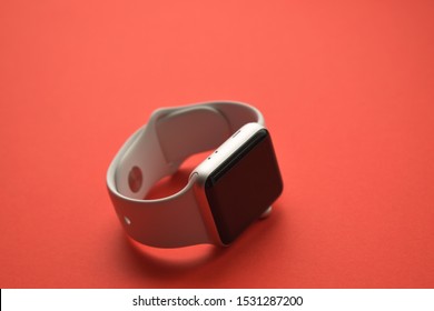 Ekaterinburg, Russia - October 2019. Apple Watch Series 3 on red background. New smartwatch from APPLE company close up isolated on white background. smart watch on your wrist