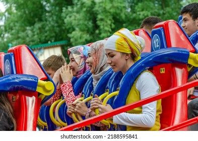 Ekaterinburg.Russia.June 21, 2022.People On Rides In An Amusement Park.