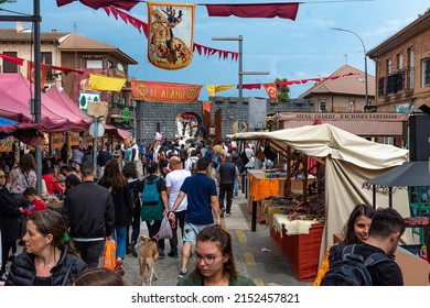 El Alamo, Madrid, Spain - May 2, 2022: Medieval Market. A People Group Visiting The Flea Market