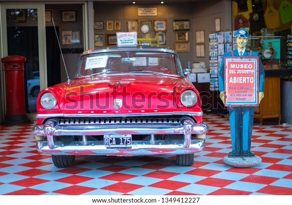 El Calafate,\
Argentina - march 14, 2019: A vintage red car of the sixties\
composes the facade of the museum of ancient toys in the center of\
the city. Argentine\
Patagonia.