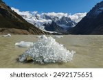 El Chalten, Argentina: Ice on the Torre lake with the famous Cerro Torre Peak near the Fitz Roy in the Los Glaciares National Park in El Chalten in Argentinian Patagonia