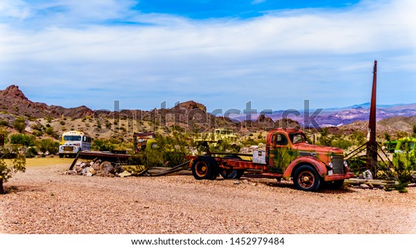 El\
Dorado Canyon, Nevada/USA - June 10 2019: Vintage vehicles used in\
several old movies are still on display in the old mining town of\
El Dorado in the Eldorado Canyon in the Nevada\
Desert