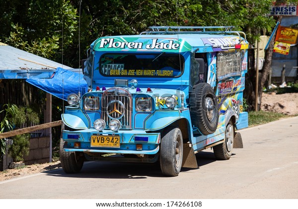EL NIDO,\
PHILIPPINES - JANUARY 29, 2014 :Jeepneys passing, Philippines\
inexpensive bus service. Jeepneys are the most popular means of\
public transportation in the\
Philippines.