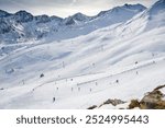  .El Pas de la Casa is a ski resort town, and mountain pass in the Encamp parish of Andorra, lying on the border with France. Skiers from above.