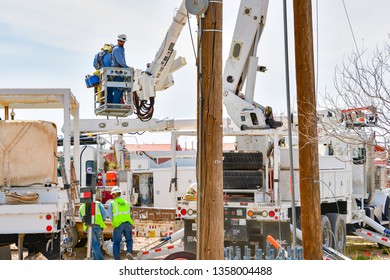 El Paso, Texas - 2 April 2019: Power Company Employees Installing A Huge, New Utility Pole.