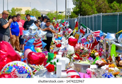 El Paso, Texas / USA - 8 August 2019 
Shocked and saddened citizens of El Paso, Texas paying their respects to the memorial wall created just outside the parking area for the Walmart store
Gun Control