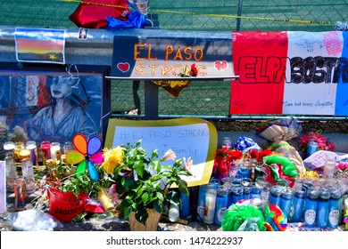 El Paso, Texas USA: Circa August 2019
   
Shocked and saddened citizens of El Paso, Texas paying their respects to the memorial wall created just outside the parking area for the Walmart store.
