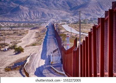 El Paso, Texas / USA: Circa November 2019
Border wall between USA and Mexico running thru the desert.