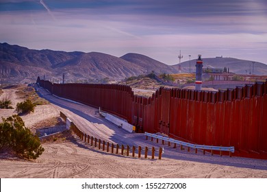 El Paso, Texas / USA: Circa November 2019
Border Wall Between USA And Mexico Running Thru The Desert.