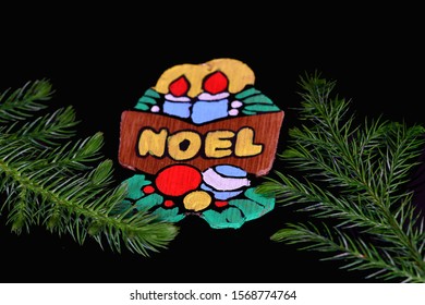 El Paso, Texas / USA: Circa November 2019
Cute Handmade Christmas Ornament On A Black Background With Pine Branches.