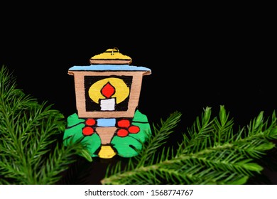 El Paso, Texas / USA: Circa November 2019
Cute Handmade Christmas Ornament On A Black Background With Pine Branches.