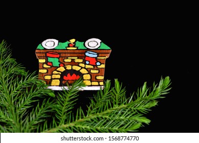 El Paso, Texas / USA: Circa November 2019
Cute Handmade Christmas Ornament On A Black Background With Pine Branches.