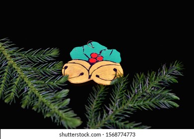 El Paso, Texas / USA: Circa November 2019
Cute Handmade Christmas Ornament On A Black Background With Pine Branches.