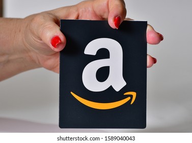El Paso, Texas / USA: Circa December 2019
Amazon gift card being held by a mature Caucasian woman with red fingernails.
