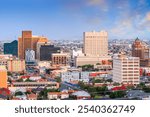 El Paso, Texas, USA downtown city skyline at dusk with Juarez, Mexico in the distance.