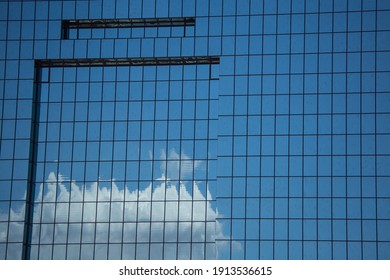 El Paso, Texas  USA – July 8, 2021: The Blue Sky And White Clouds Reflect Off The Court House Windows.