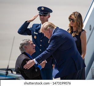 EL PASO, TX – 	AUGUST 7. President Donald Trump And Melania Greet Governor Greg Abbot At The El Paso International Airport In El Paso, Texas – 7 Aug 2019

