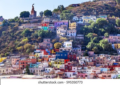 El Pipila Statue Many Colored Orange Blue Red Houses Of Guanajuato Mexico.  Hero In 1810 Mexican War Of Independence