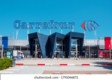 EL PRAT DE LLOBREGAT, SPAIN - AUGUST 7, 2020: A view of the main facade of the Carrefour hypermarket, a popular hypermarket chain in Spain, and one of the most important hypermarket chains in Europe