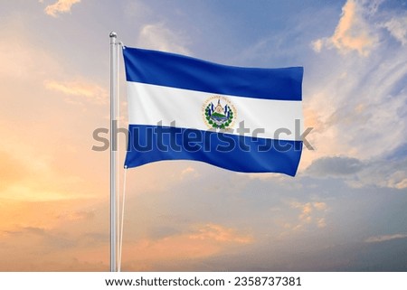 El Salvador flag waving on sundown sky
