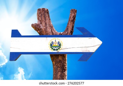 El Salvador Flag wooden sign and sky background