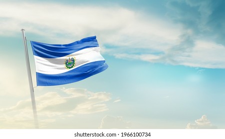 El Salvador National Flag Waving In Beautiful Sky.