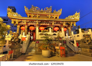Elaborate inner building of Kwan Tai Temple in Chinatown of Yokohama, Japan during night time.
