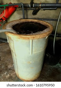 Elaboration and incubation of compost tea in a small container of 150L.  Air blower hose attached to the functioning device, formation of some foam on the water surface is seen