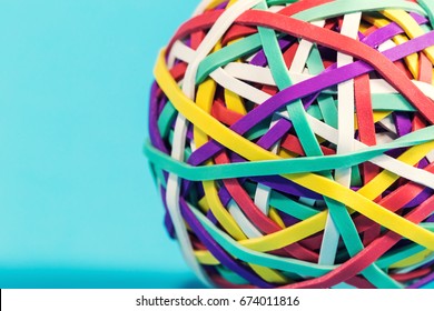 Elastic Rubber Band Ball On A Blue Background