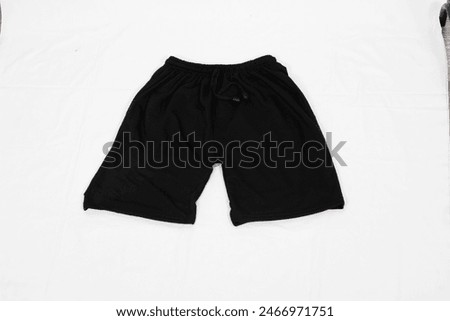 elastic waistband with a drawstring for a comfortable and adjustable fit. The simple yet stylish design makes them versatile for various activities, including workouts, lounging, or casual wear.