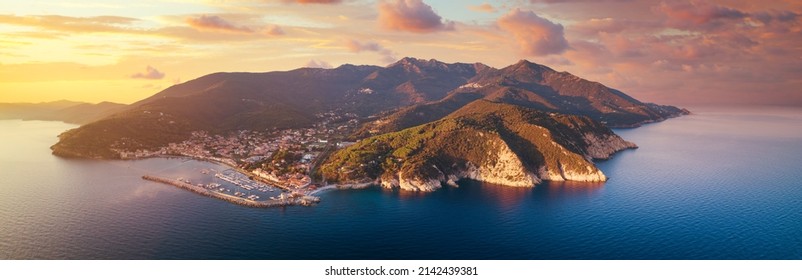 Elba island with Marciana Marina harbor. Aerial view at sunshine. Tuscany, Italy. - Shutterstock ID 2142439381