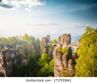 Elbe Sandstone Mountains in sunlight at day. Location Saxon Switzerland national park, Bastei bridge, East Germany, Europe. Scenic image of popular travel destination. Discover the beauty of earth.