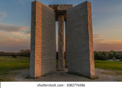 ELBERT, GEORGIA - APRIL 2: The Georgia Guidestones, also known as the "American Stonehenge", as seen on April 2, 2018 in Elbert, GA. The inscription is of 10 principles in 8 different languages.