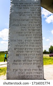 Elberton, GA/USA - April 26 2020:
Full view of granite slab at the Georgia guidestones with the tenets of the monument engraved in Hebrew