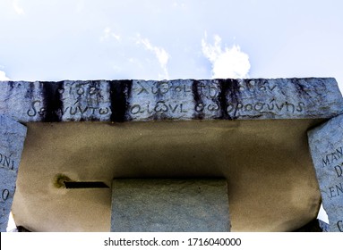 Elberton, GA/USA - April 26 2020:
Close view of the granite slab capstone, atop the Georgia Guidestones, showing the Classical Greek engravings