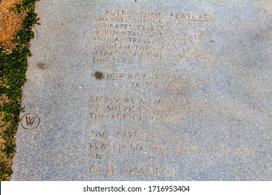 Elberton, GA/USA - April 26 2020:
Close view of the westerly portion of the information slab, in the ground, at the Georgia Guidestones, listing it's astronomical features, author and sponsors.