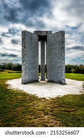 ELBERTON, UNITED STATES - Oct 25, 2021: The Georgia Guidestones near Elberton with English, Russian, and cuneiform inscriptions under a cloudy sky