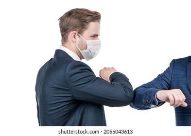 Elbow Bump Is The New Handshake. Broker In Face Mask Elbow Bump With Man. Elbow Bumping