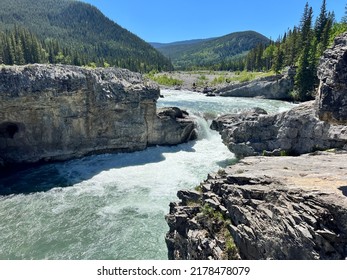 Elbow Falls. Fast Flowing Water In Kananaski