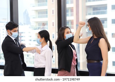 Elbow Greeting To Avoid The Spread Of Coronavirus COVID 19. Office Worker Meet In Office With Bare Hands. Instead Of Greeting With A Hug Or Handshake They Bump Elbows Instead