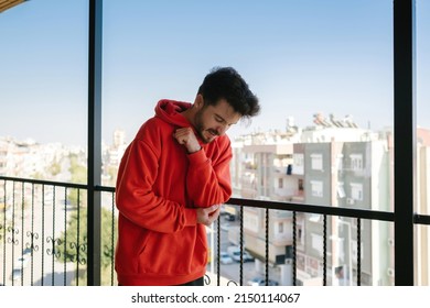 Elbow Pain, The Young Man Has Hit His Elbow On The Balcony Rails And Is In Pain, Adult Grinding Their Teeth In Pain