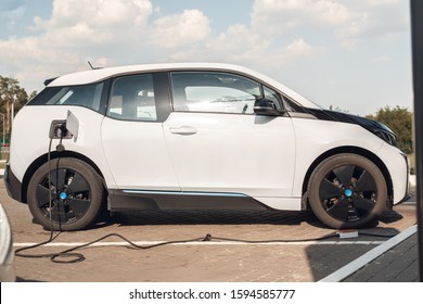 Elcetric Car On Charging Station Isolated No People Transportation Power In Ev Plug Side View