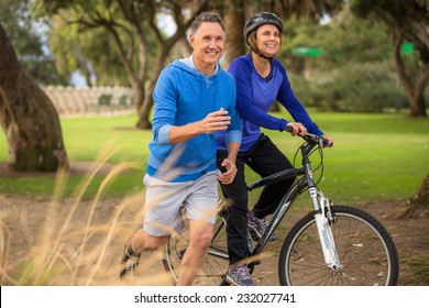 Elder couple exercising in the park
