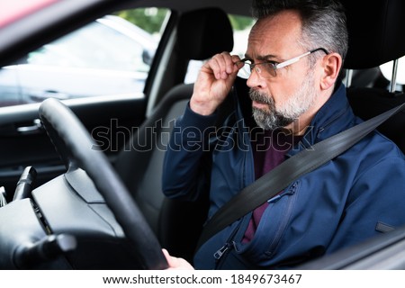 Elder Male Car Driver In Front Seat