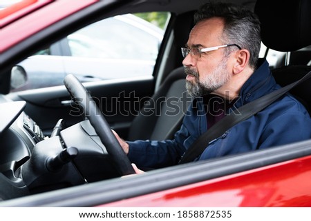 Elder Male Car Driver In Front Seat