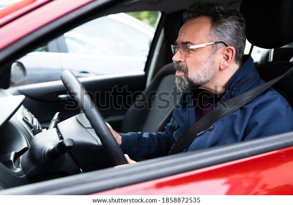 Elder Male Car Driver In
Front Seat