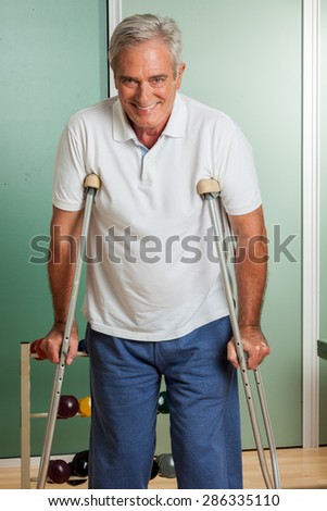 elder man using a crutches