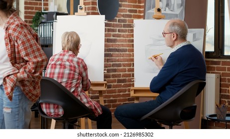 Elder People Learning To Draw On Canvas In Art Workshop At Community Centre, Attending Class For Personal Development And Growth. Drawing Lesson And Practice With Artistic Tools. Tripod Shot